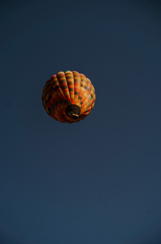 Hot-air balloon against a dark blue sky